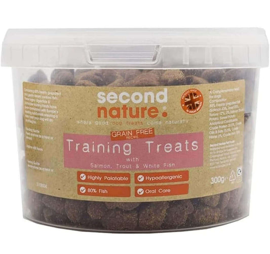 Container of Second Nature grain-free dog training treats with salmon, trout, and white fish, labeled as highly palatable and hypoallergenic.