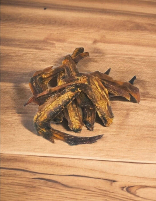 Dried fish on wooden surface for culinary use